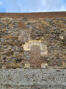 Dichtgemetselde poterne in de Looiershofmuur